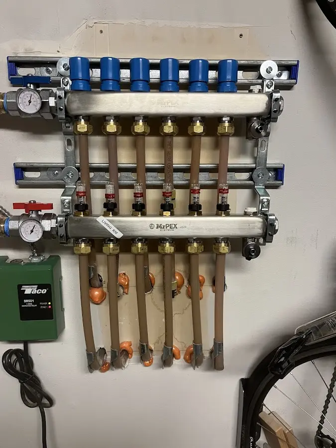 Plumber performing Water Heater Repair at a residential property in Mila Doce